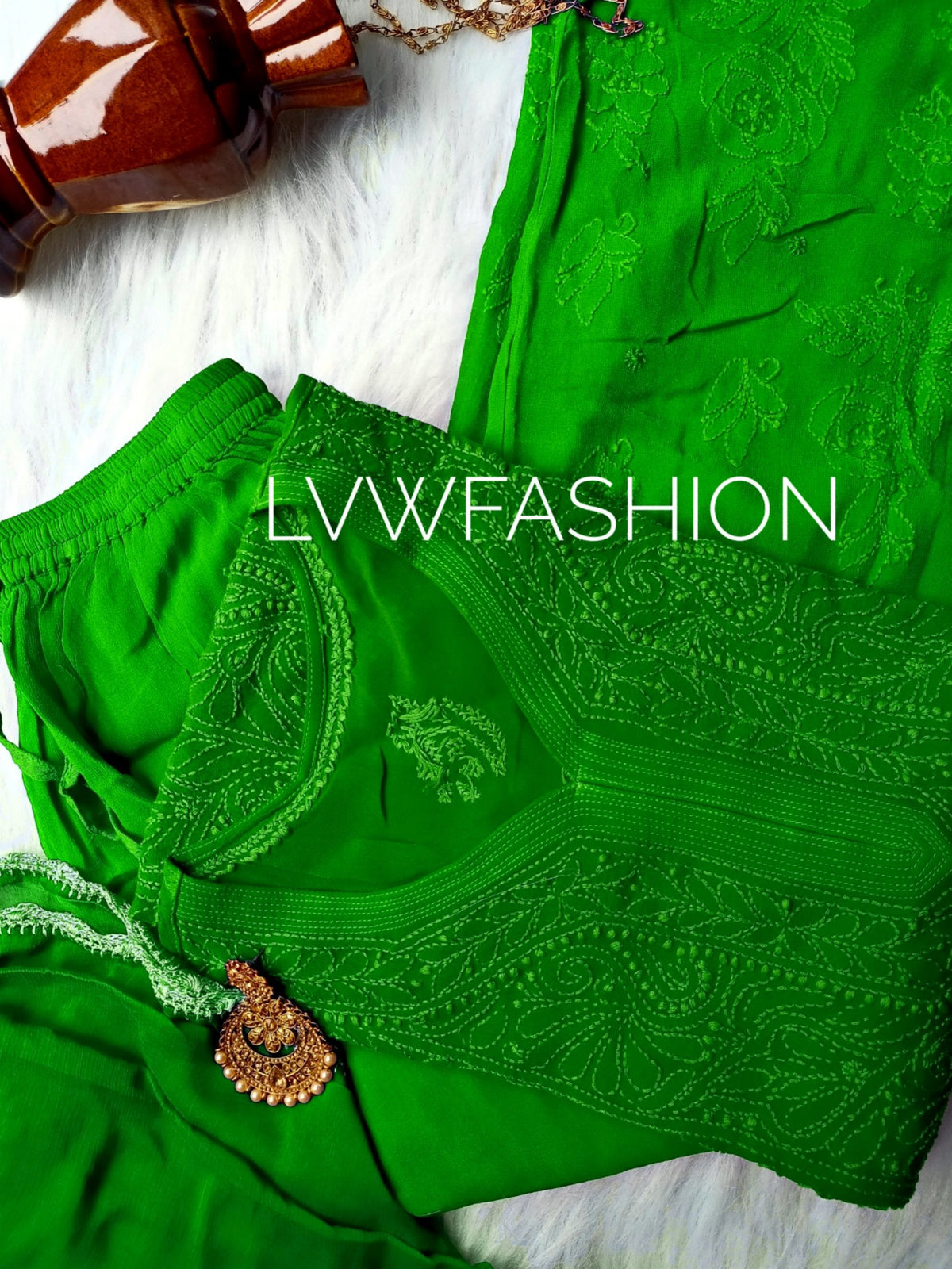 Green premium georgette 3-piece plazzos set by LVW Fashion Luxurious Chikankari, featuring flowy fabric and intricate detailing.