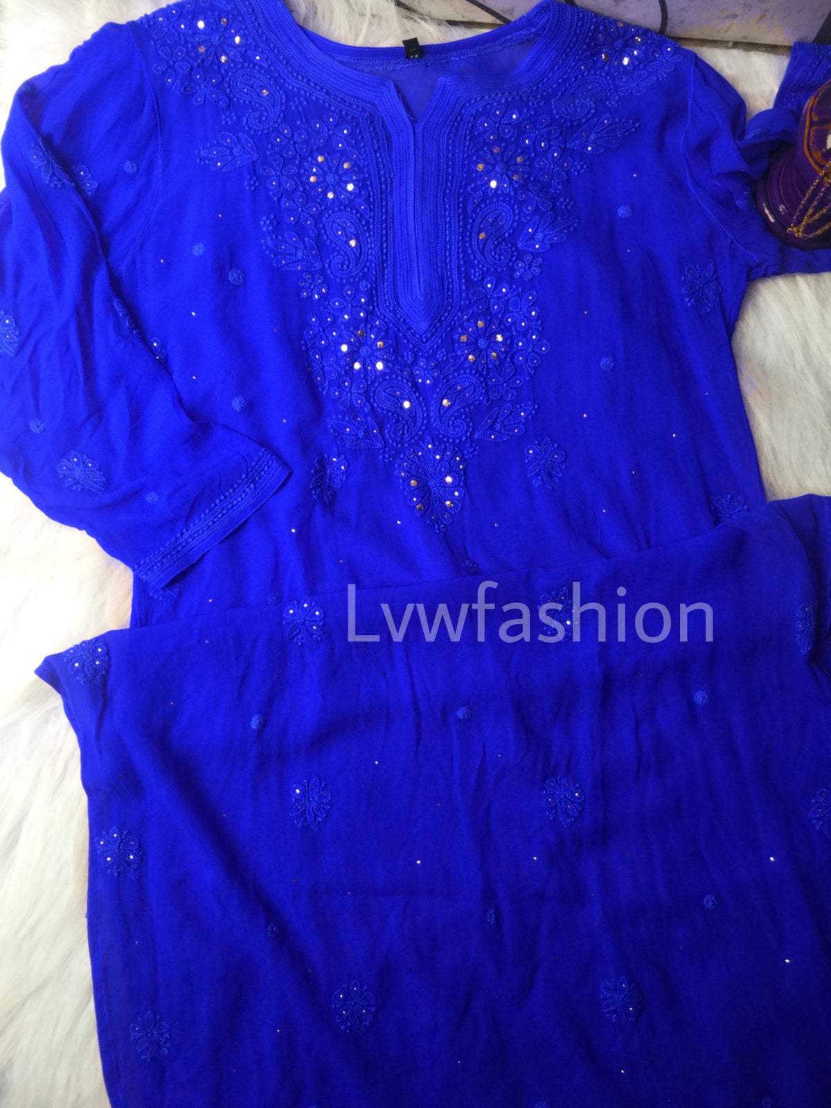 Luxurious blue georgette 3-piece set with slip by LVW Fashion, featuring intricate chikankari embroidery and lightweight fabric.