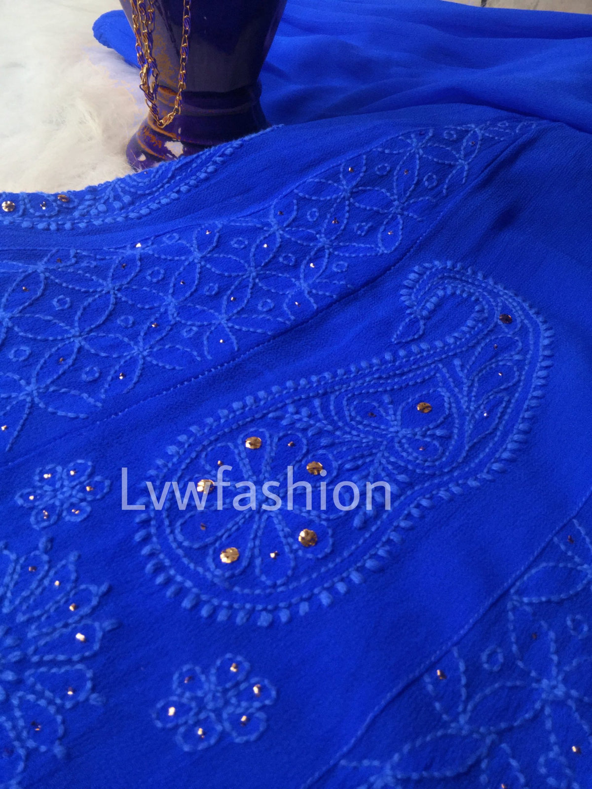 Blue premium georgette 3-piece set with slip by LVW Fashion Luxurious Chikankari, featuring intricate embroidery and elegant design.