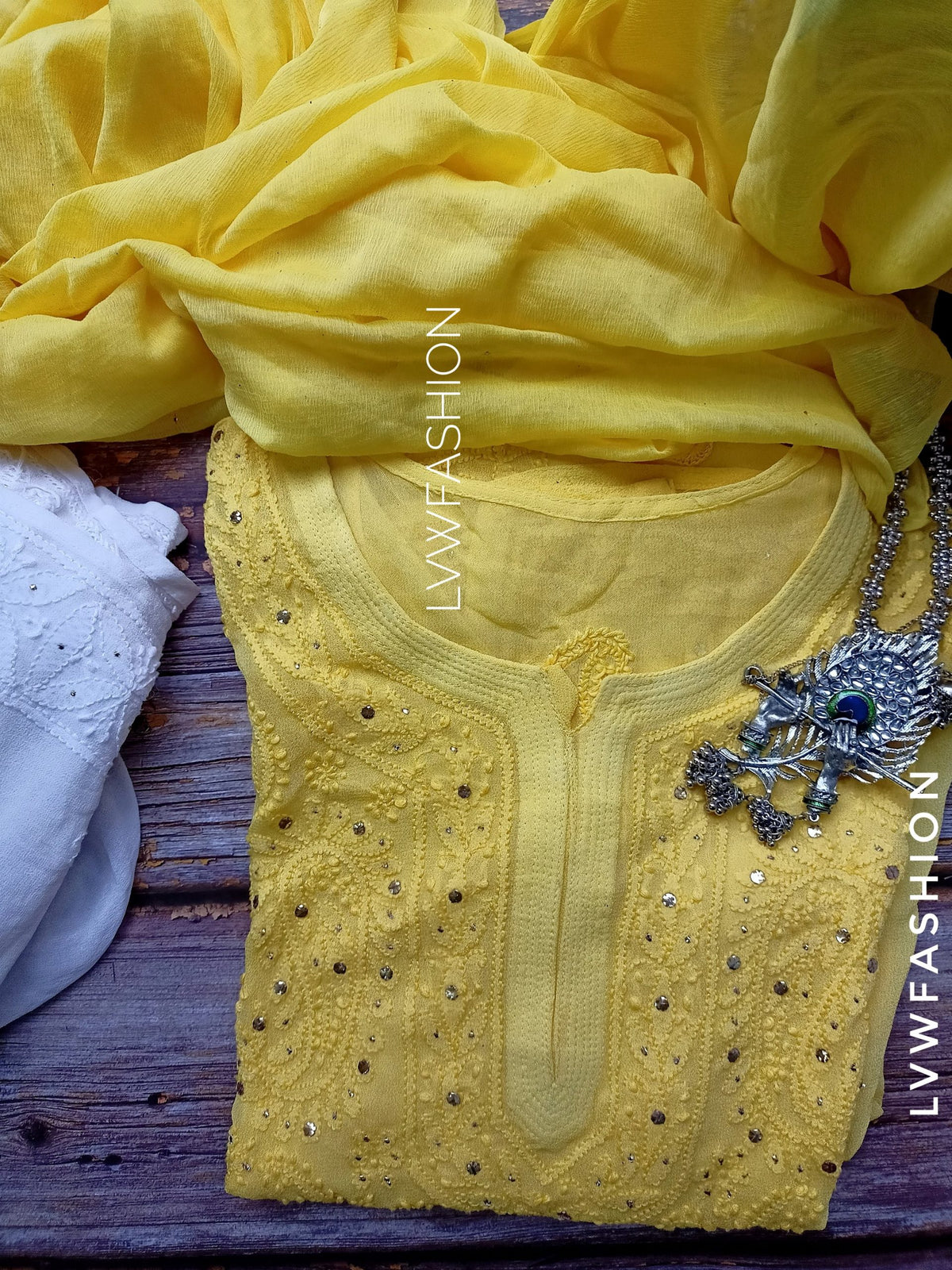 Premium white and yellow georgette Gharara set with intricate Chikankari embroidery by LVW Fashion.