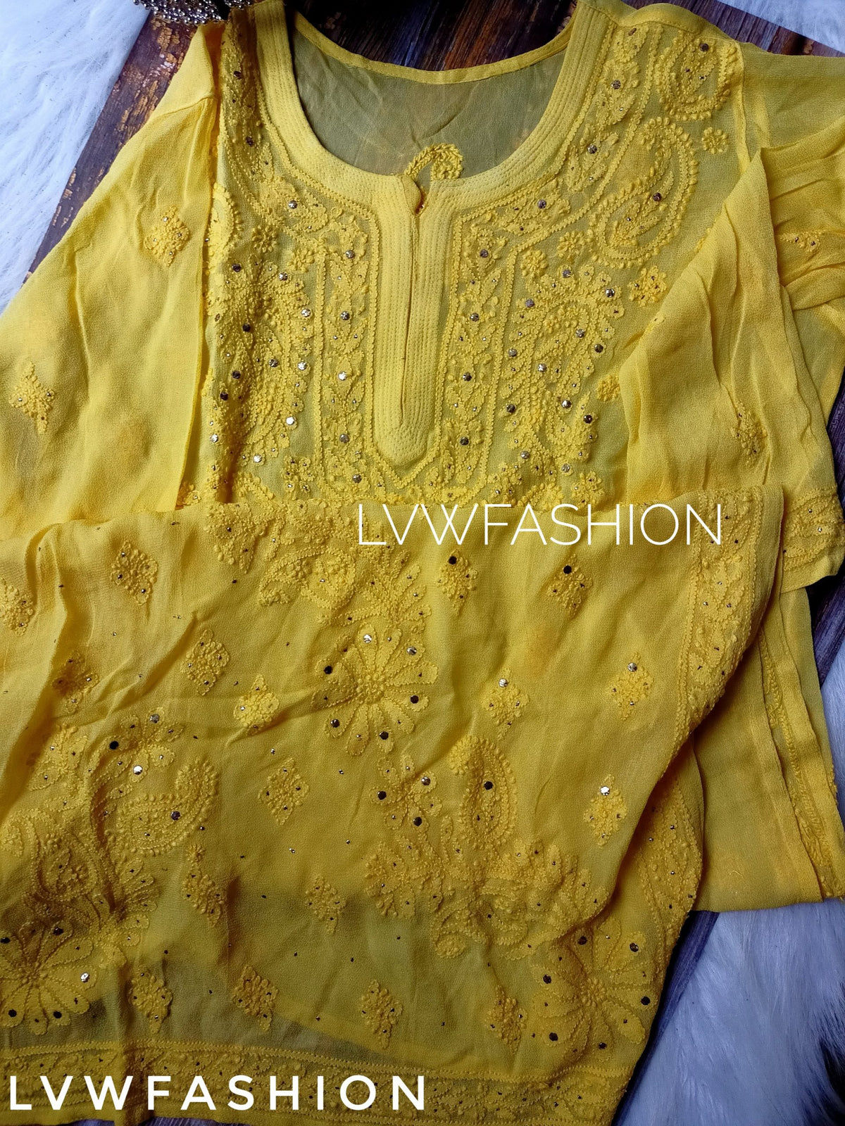 Premium white and yellow georgette Gharara set by LVW Fashion with intricate Chikankari embroidery, traditional Indian attire.