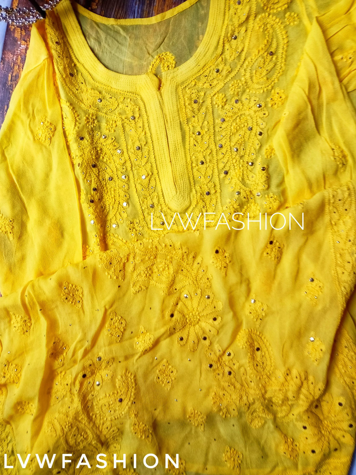 Elegant white and yellow georgette Gharara set with intricate chikankari embroidery from LVW Fashion Luxurious.