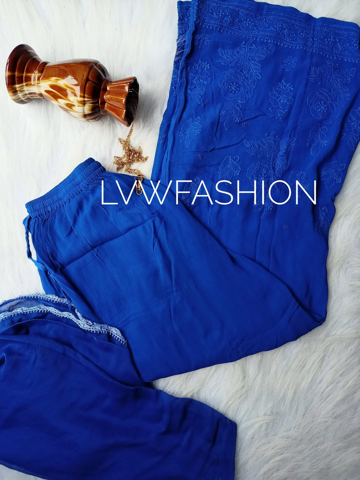Premium midnight blue georgette 3-piece set by LVW Fashion with elegant chikankari embroidery, showcasing intricate detailing.