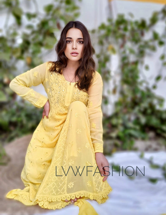 Yellow georgette 3-piece sharara set with intricate chikankari embroidery by LVW Fashion, shown on a model.