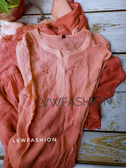 Rust orange premium georgette 3-piece set with intricate Chikankari embroidery from LVW Fashion, displayed on a hanger.