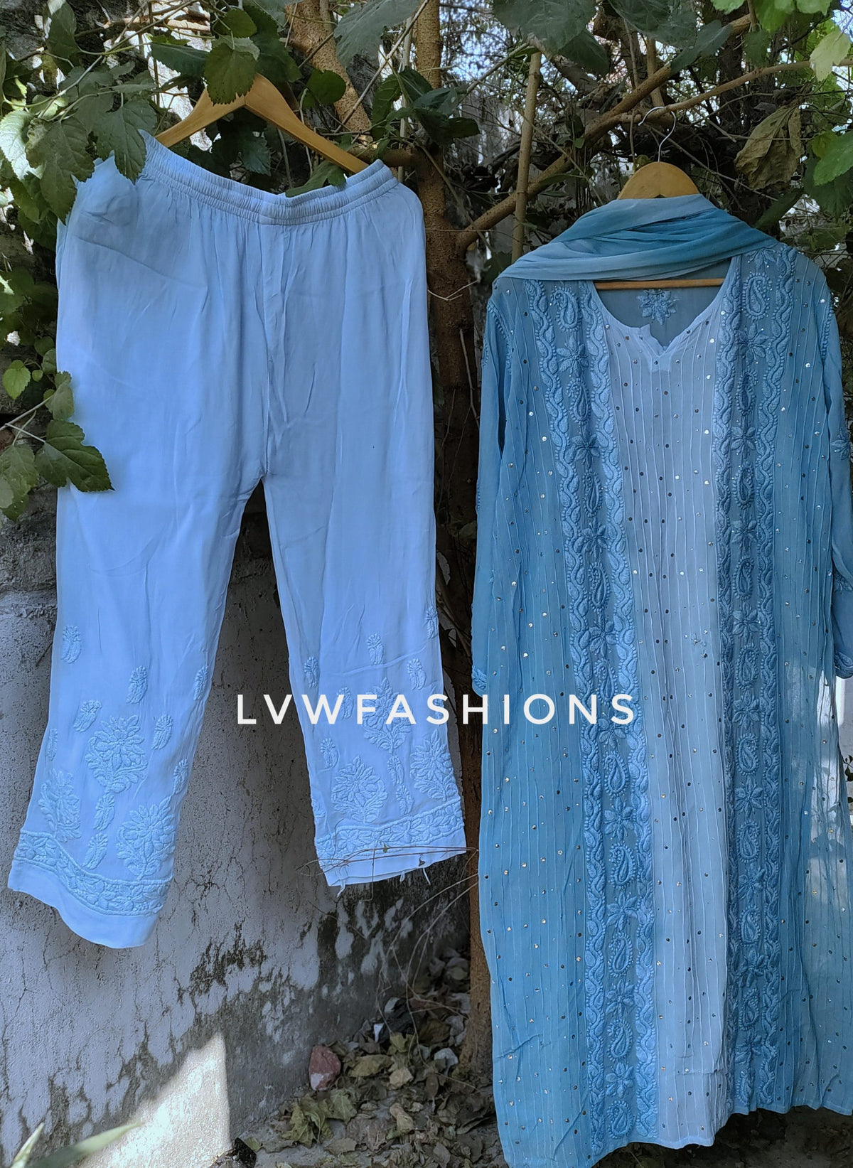 A F I Y A Premium Georgette 3-piece set with silk long slip from LVW Fashion, featuring intricate chikankari embroidery and elegant fabric.