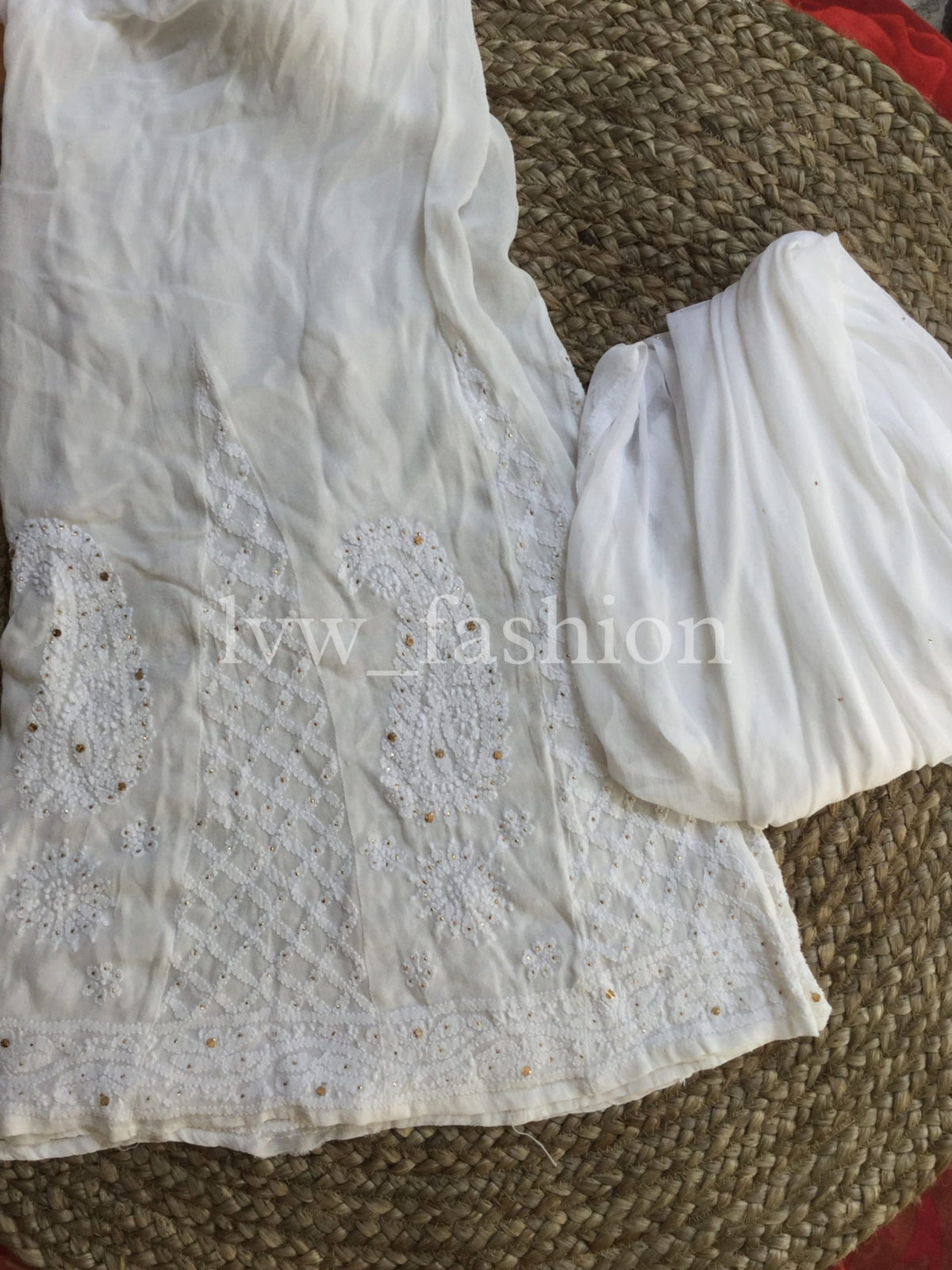 Luxurious green and white georgette fabric with intricate Chikankari embroidery by LVW Fashion, showcasing elegant craftsmanship.