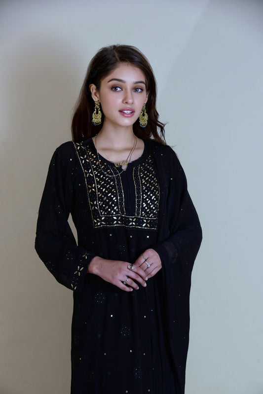 U&K Naira black and white chikankari kurti and sharara set in premium georgette with intricate embroidery by LVW Fashion.
