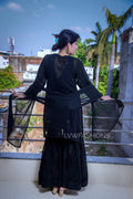 Elegant U&K Premium Georgette Black and White Gharara Set by LVW Fashion with intricate Chikankari embroidery.