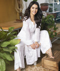 Celebrity-inspired white georgette 3-piece set by LVW Fashion Luxurious Chikankari featuring intricate embroidery and elegant design.