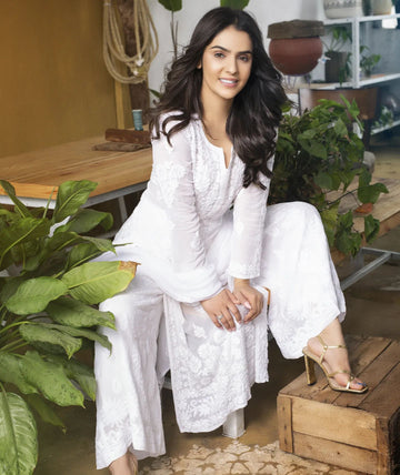 Celebrity-inspired white georgette 3-piece set by LVW Fashion Luxurious Chikankari featuring intricate embroidery and elegant design.