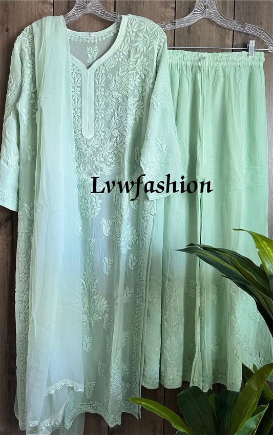 Winter green handcrafted georgette suit set by LVW Fashion with intricate chikankari embroidery, luxurious and elegant traditional attire.