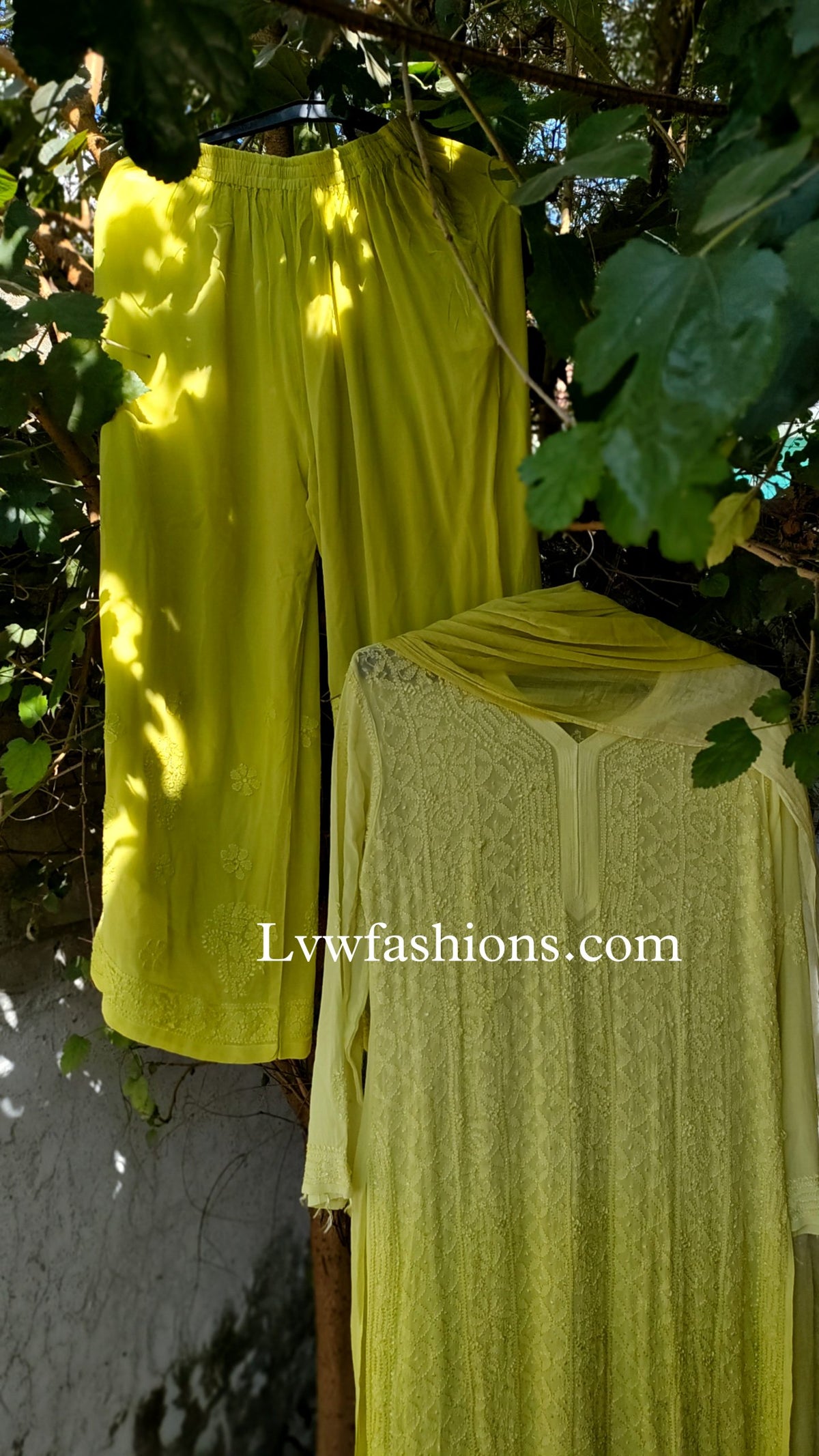 LVW Fashion luxurious chikankari 3-piece set with premium georgette fabric and silk long slip inner, showcasing intricate embroidery.