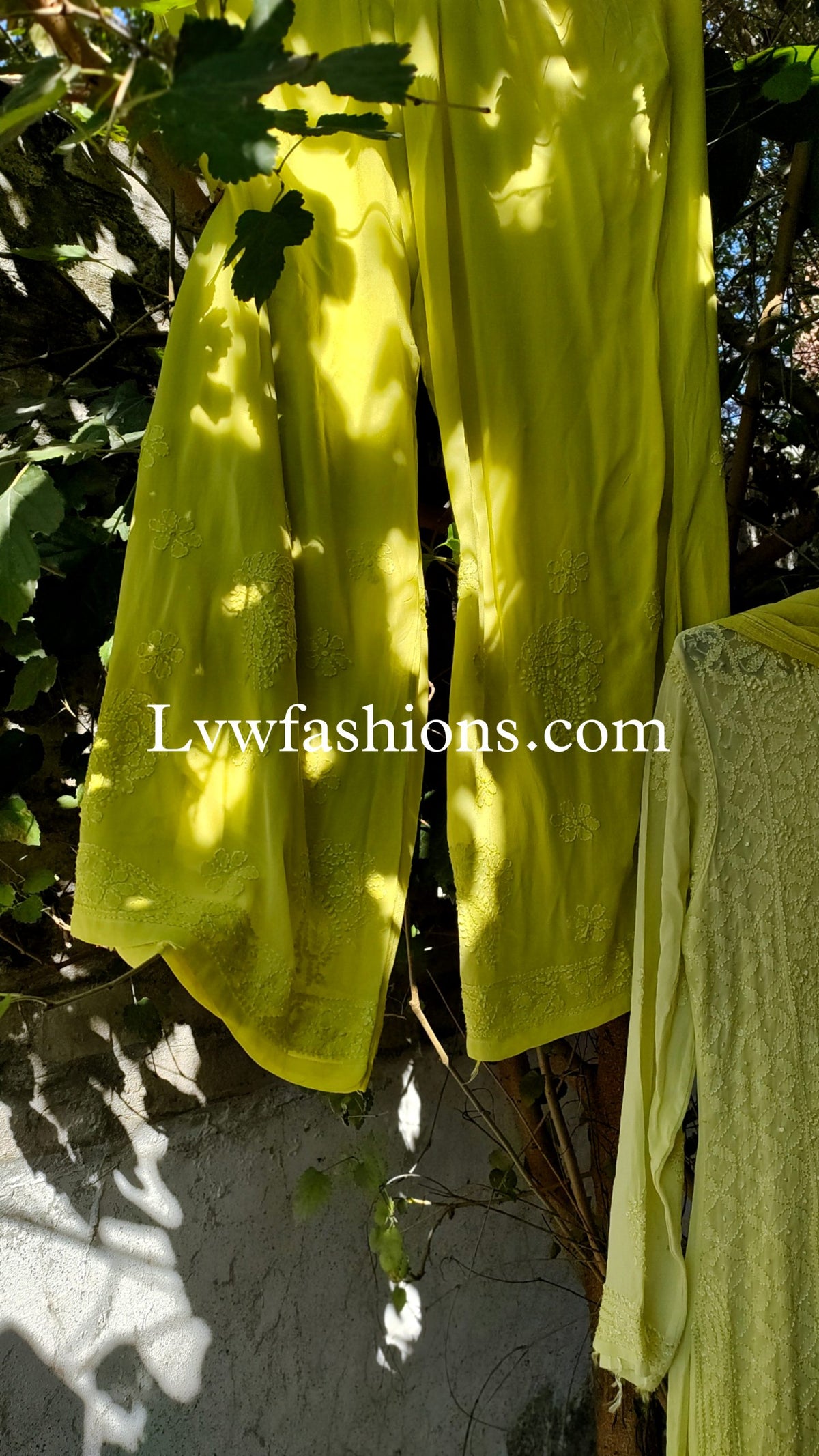 Elegant LVW Fashion luxurious chikankari 3-piece set in premium georgette with silk long slip, featuring intricate embroidery and stylish design.