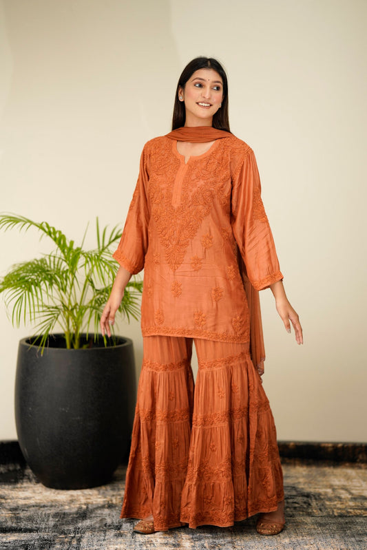 Luxurious Pazeb Muslin Silk Chikankari Gharara Set by LVW Fashion with shining silk and intricate embroidery on a traditional outfit.