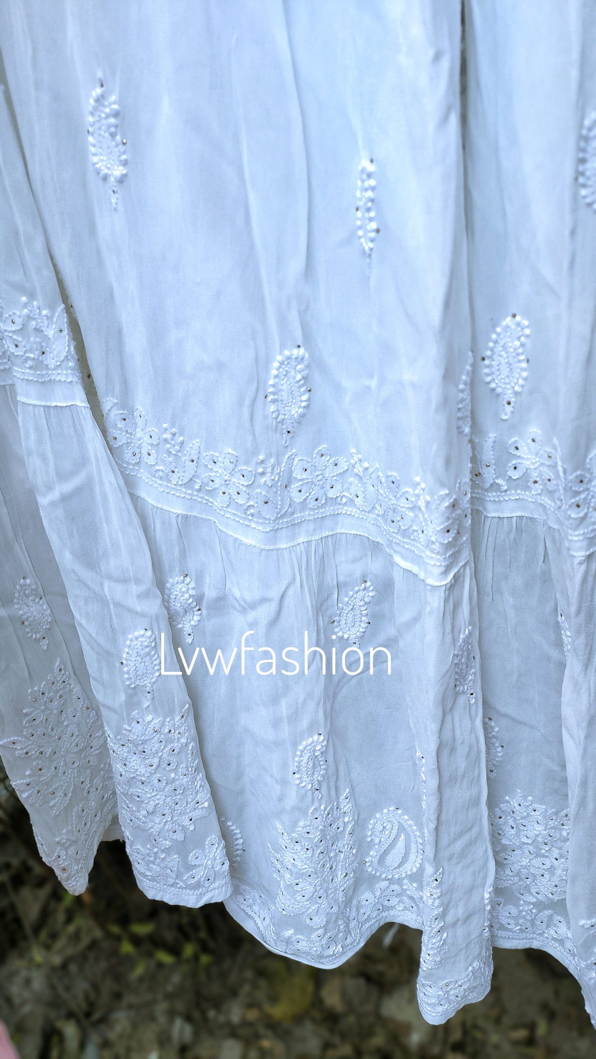 Peaches premium georgette Gharara 3-piece set with luxurious Chikankari embroidery, featuring a traditional Indian ethnic outfit.