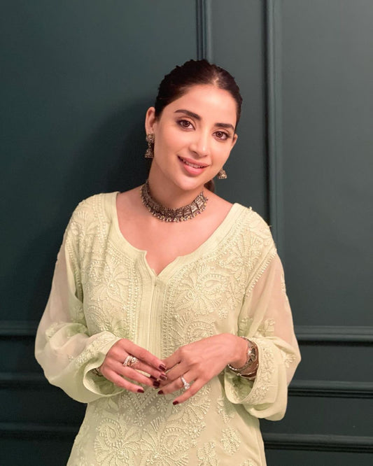 Beautiful green premium georgette short Kurtis with inner, by LVW Fashion Luxurious Chikankari, showcasing intricate embroidery.