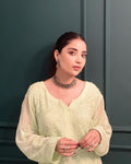 Beautiful premium pistachio georgette short kurti with intricate chikankari embroidery and matching inner by LVW Fashion.