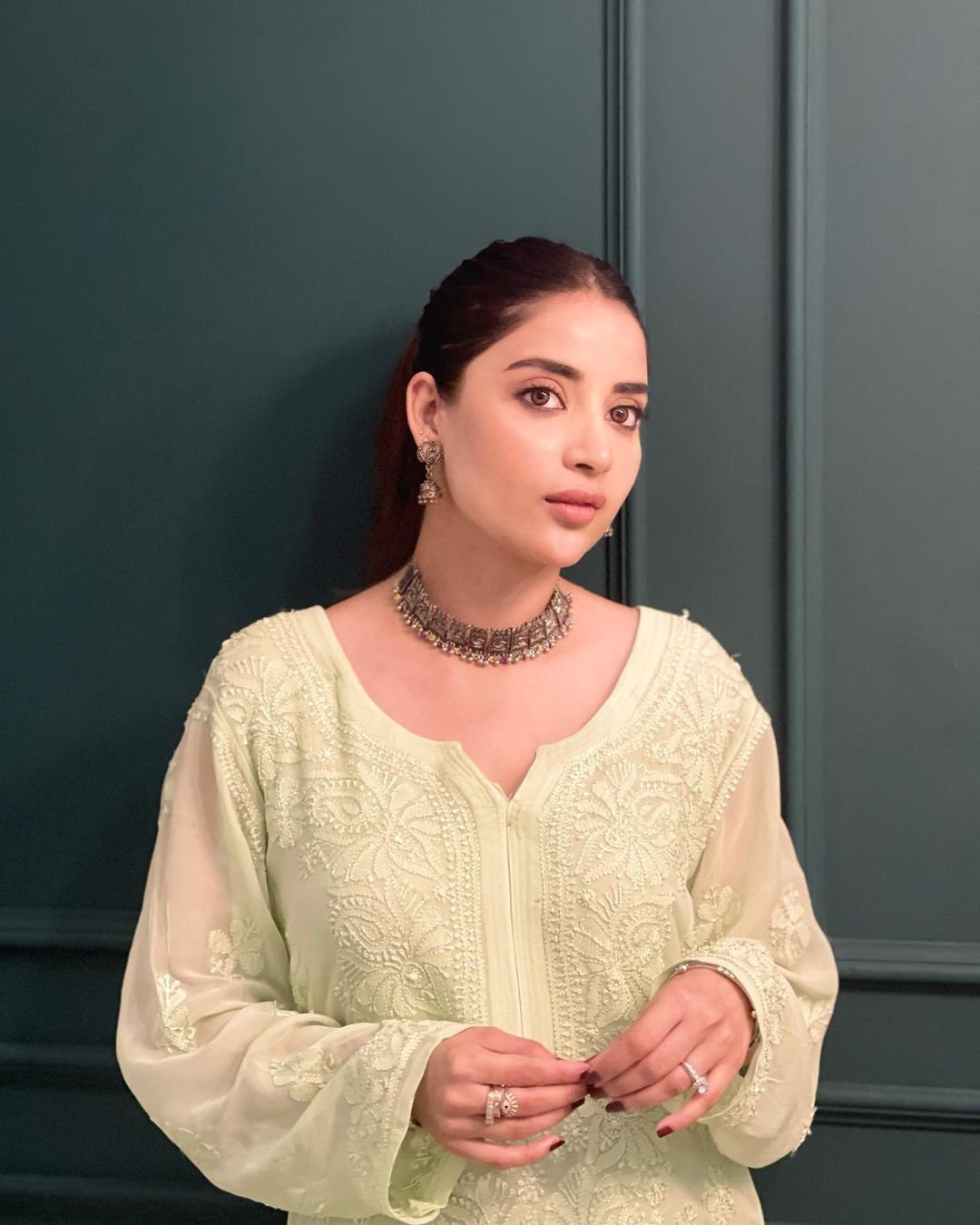 Beautiful premium pistachio georgette short kurti with intricate chikankari embroidery and matching inner by LVW Fashion.