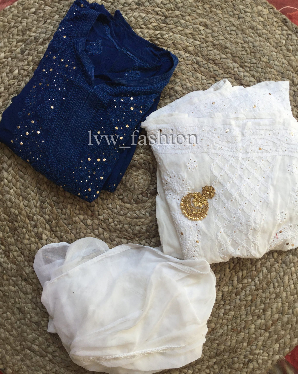 Blue and white kurta set by LVW Fashion with intricate Chikankari embroidery, featuring a luxurious traditional design.