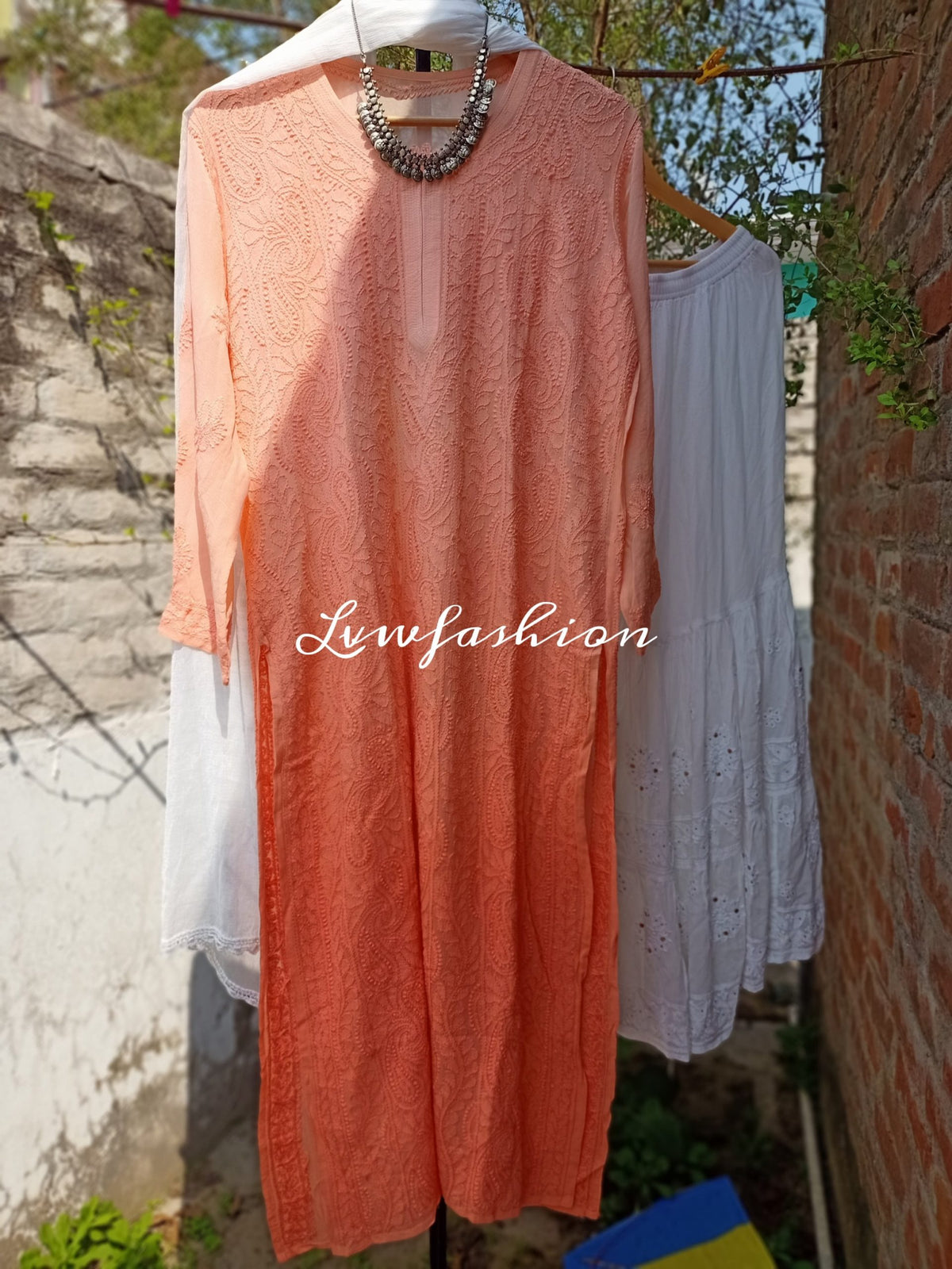 Peach and white resham thread Gharara set with intricate Chikankari embroidery by LVW Fashion, featuring traditional Indian style.
