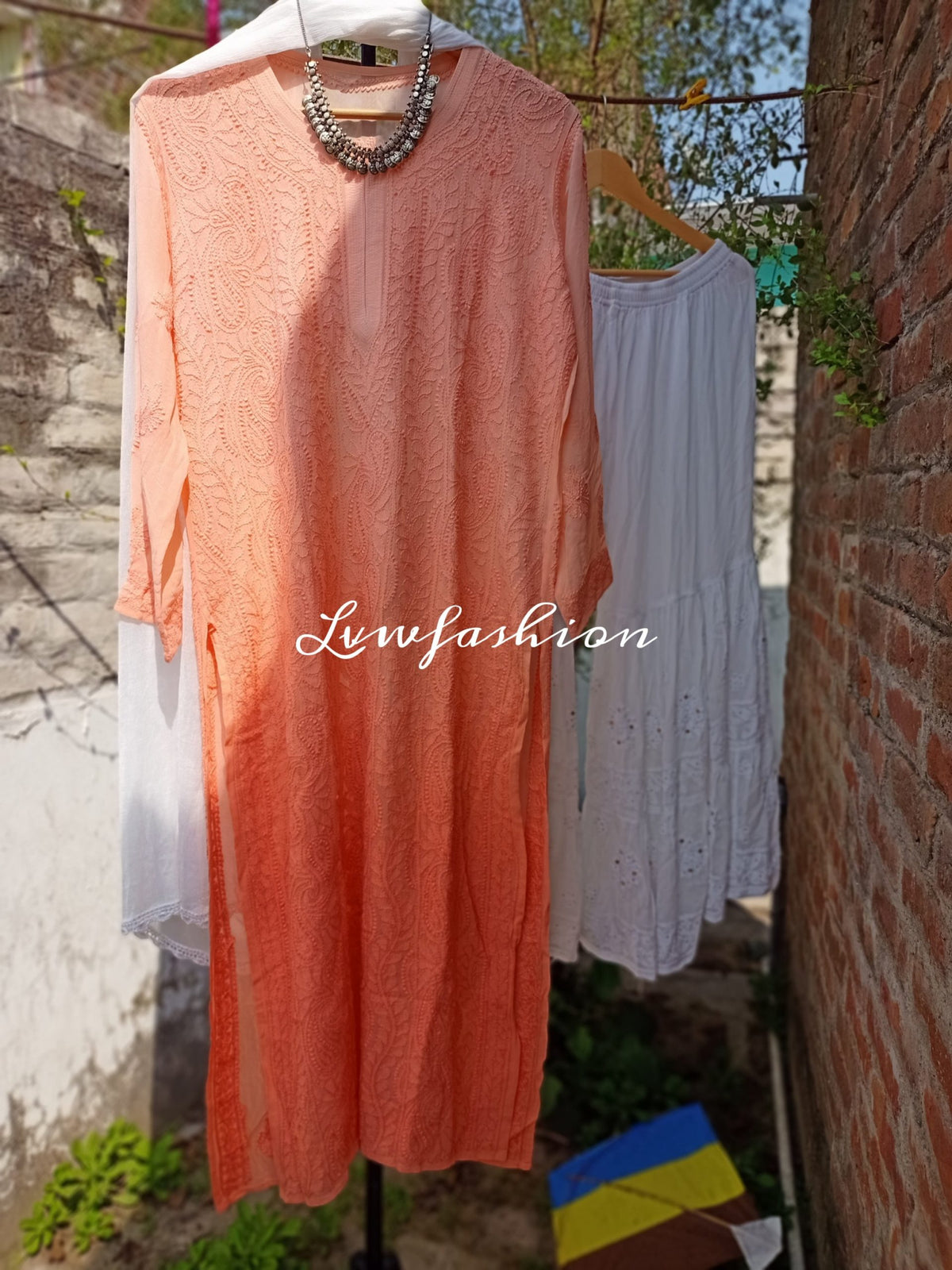 Peach and white resham thread Gharara set with intricate Chikankari embroidery by LVW Fashion, featuring traditional craftsmanship.