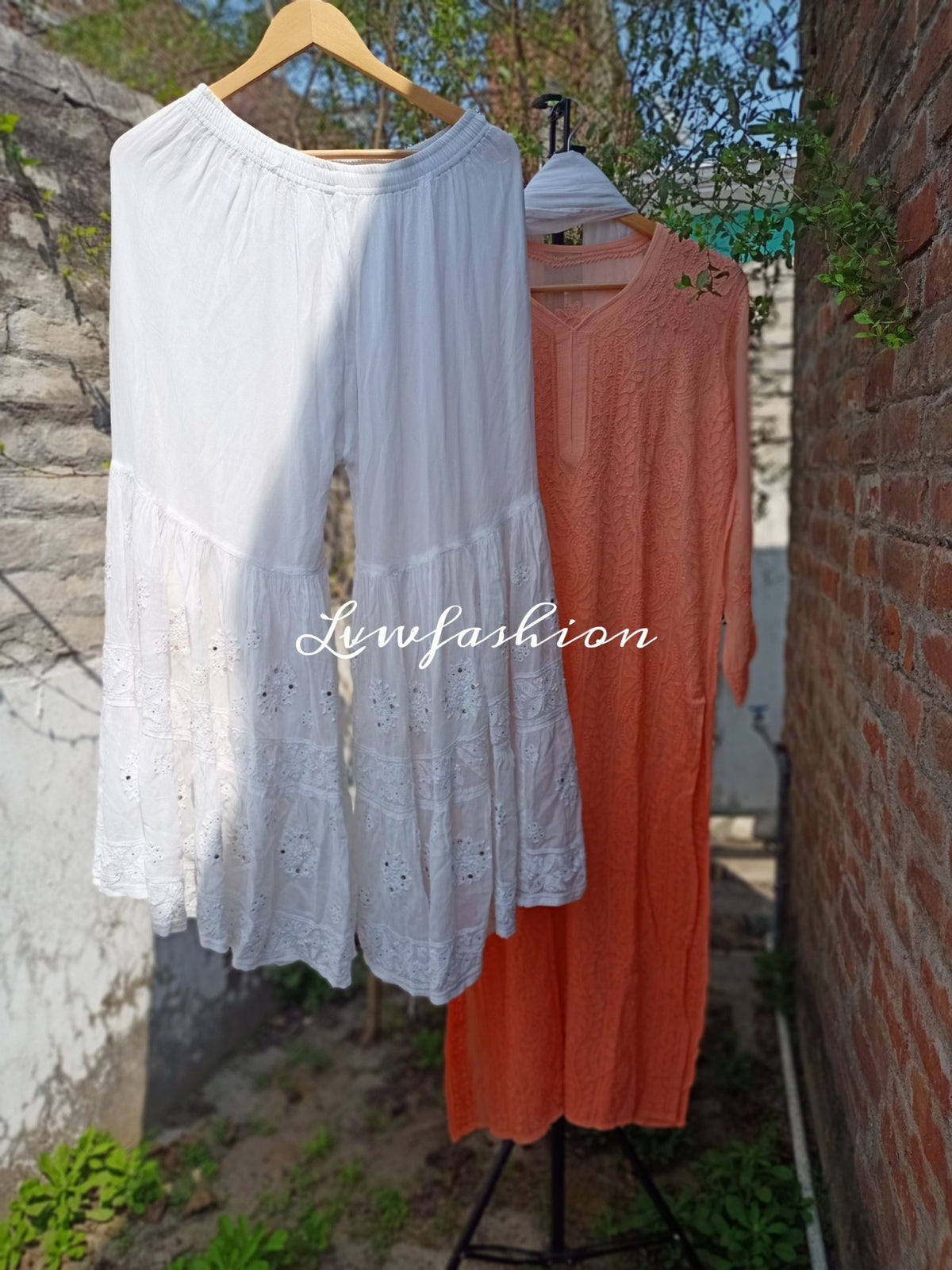 Peach and white Resham thread Gharara set with intricate Chikankari embroidery by LVW Fashion, featuring traditional Indian design.