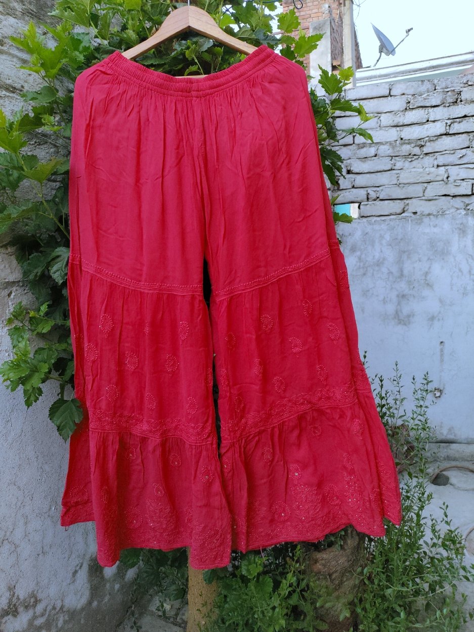 Rust premium georgette Chikankari Gharara set by LVW Fashion with intricate embroidered detailing on the top and matching wide-leg pants.