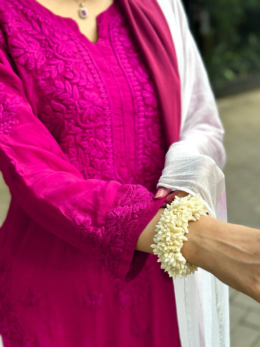 White Sariya Tyrian Muslin Silk Chikankari Kurta Set by LVW Fashion, showcasing intricate hand-embroidery on a luxurious silk fabric.