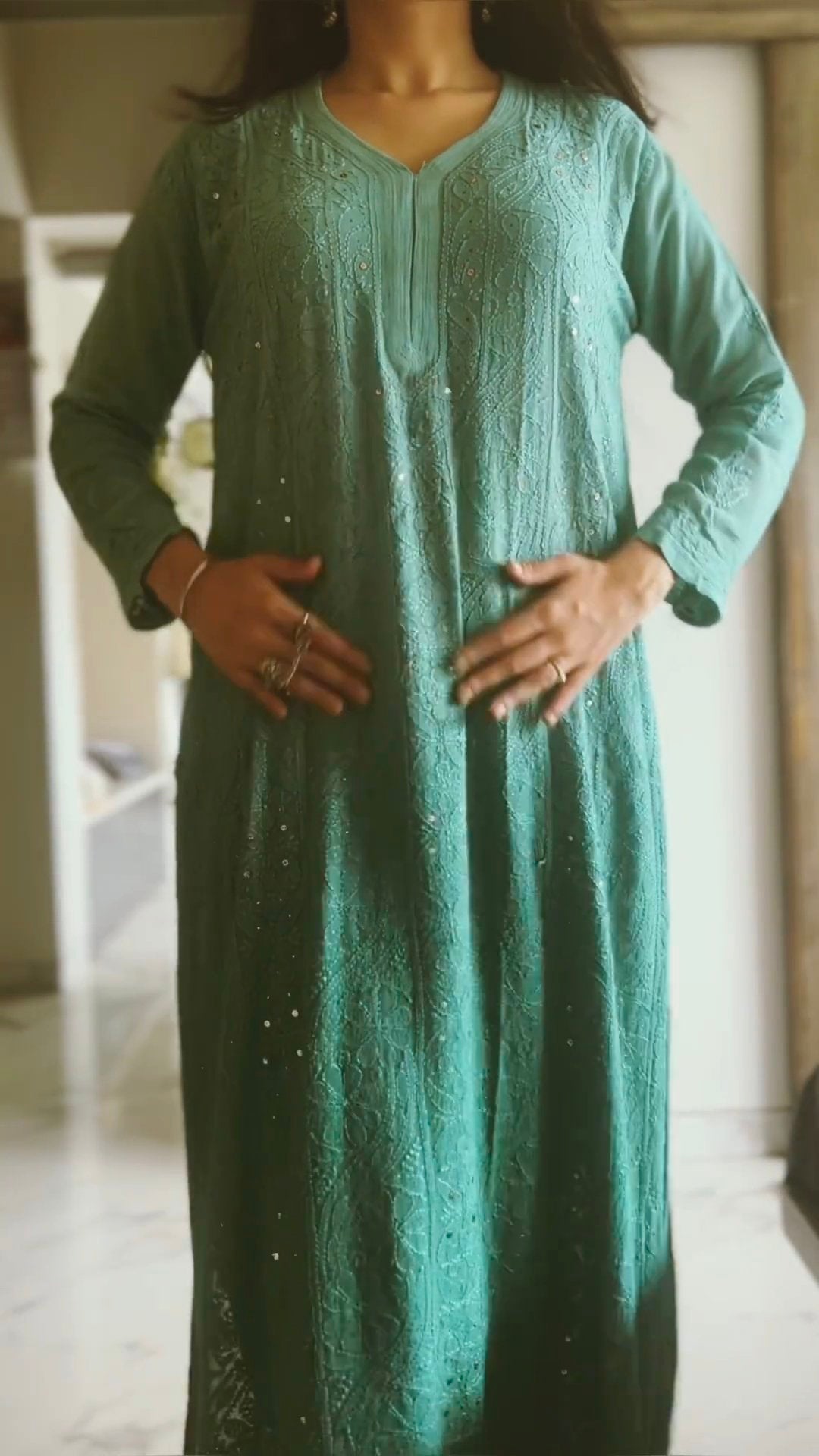 Green ombre long kurta with intricate chikankari embroidery in premium georgette fabric, styled with matching dupatta.