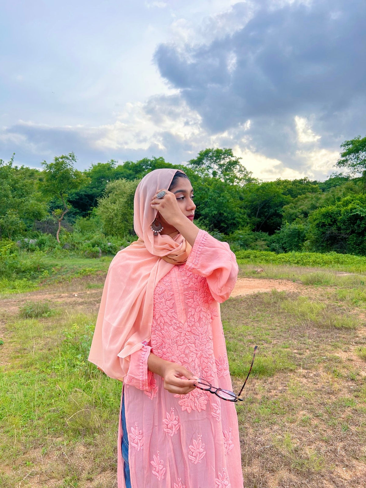 Peach-colored silk long kurta with shining finish and chikankari embroidery, paired with matching pants and dupatta by LVW Fashion.